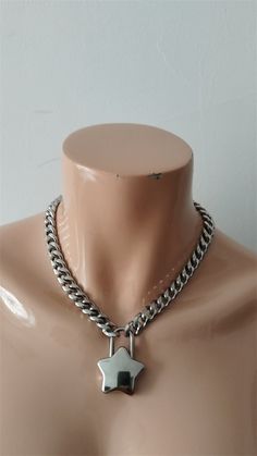 The product is a combination of stainless steel chains and alloy hearts. The length of the necklace on the model is 16 inches. If you need other lengths, please write to customize other lengths. The width of the necklace is 11mm, approximately 4.33 inches. You can also write to inquire about the width you need. Metal Chain Necklace With Heart Pendant, Silver Heart Pendant Chain Necklace With Chunky Chain, Silver Stainless Steel Heart Pendant Chain Necklace, Silver Stainless Steel Heart Pendant Necklace, Silver Stainless Steel Necklace With Lobster Clasp, Metal Cuban Link Necklace With Lobster Clasp, White Silver Cuban Link Chain Necklace, White Cuban Link Silver Chain Necklace, Silver Heart Pendant Chain Necklace With Adjustable Chain