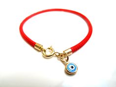 "Kabbalah good luck bracelet 14k gold red string Luxurious bracelet 14k solid Gold beautiful solid yellow 14 k gold and Italian leather bracelet delicate bracelet See description below: * Italian red embroidered leather cord 2.5mm * 14k solid gold and enamel evil eye charm - 6mm - 0.025gr * 14 k solid Gold end caps * 14 solid Gold spring closure *By Symbolina Evil eye: Is a sign of protection that also represents blessings, power, and strength, and is seen as potent in deflecting the evil eye. F Adjustable Bracelet With Gold Clasp For Gifts, Yellow Gold Charms Bracelet For Good Luck, Yellow Gold Good Luck Charms Bracelets, Adjustable Yellow Gold Bracelets With Charms, Good Luck Charms Bracelet, Handmade 14k Gold Jewelry For Good Luck, Yellow Gold Evil Eye Jewelry For Good Luck, Yellow Gold Round Jewelry For Blessing, Dainty Evil Eye Jewelry For Good Luck