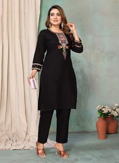 This women's kurta pant set is perfect for those who love a touch of elegance in their outfits. The black color adds a classic and versatile look, while the linen fabric ensures comfort throughout the day. The kurta is adorned with beautiful floral thread embroidery, adding a feminine and stylish touch. With a round neck and 3/4 sleeves decorated with embroidery, it's a perfect blend of traditional and modern design. The pant features a partially elasticated waist for a comfortable fit and a convenient side pocket for added functionality. Elegant Black Palazzo Set For Navratri, Festive Embroidered Workwear Sets, Elegant Embroidered Kurta For Work, Traditional Embroidered Workwear Sets, Eid Festival Black Straight Kurta Set, Elegant Straight Kurta Palazzo Set For Work, Elegant Palazzo Set With Straight Kurta For Work, Black Kurta For Workwear And Eid, Black Cotton Palazzo Set For Festive Occasions