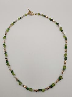 Closure: 14k gold plated D/T Chain style: Bead Style: Statement Size: Genuine green peridot raw nugget(6mm), amethyst facet Quartz beads (4mm), raw diopside nuggets(4-6mm),  and ocean agate beads (4mm)handmade necklace. Spacer:  3mm beads Necklace length: 19' This matching necklace is more gorgeous in real than in the picture. Beading makes me peaceful. Hope you will smile when you receive it. These are genuine green peridot raw nuggets (6mm), and raw diopside nuggets with small crackles, flaws, and uneven surfaces. No polish.  It is 100% handmade jewelry; each piece is one of a kind, and I hope you will enjoy it! Please feel free to contact me for customization or if you have questions. Your satisfaction is guaranteed when you make a purchase from me. If for any reason you're not complete Ocean Agate, Quartz Beads, Green Peridot, Beads Handmade, Wedding Jewelry Sets, Matching Necklaces, Agate Beads, Style Statement, Beads Necklace