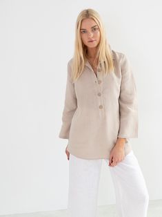 "LARA is a tunic style linen pullover shirt with long sleeves. DETAILS - Tunic style design - Long Sleeves - Collared - 100% midweight European linen fabric - Cut and sewn to order just for you in our studio COLOR - Beige, you can also choose other colors above - Fabric samples are available here https://www.etsy.com/listing/586569696/linen-fabric-samples SIZING & FIT - Length (shoulder to hem) is approximately 28 inches / 71 cm - Bust (pit to pit) is approximately 19 inches / 48 cm - Waist Linen Tunic Shirt, Wide Leg Linen Trousers, Kimono Wrap Dress, Shirt Linen, Studio Color, Tapered Trousers, Linen Tunic, Tunic Style, High Quality Dress