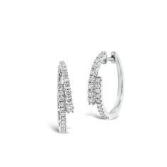 These sleek crossover earrings are a modern take on the classic diamond hoop. They’re an ideal way to add a sophisticated edge to any ensemble. -18K gold weighing 4.57 grams -40 round diamonds totaling 0.57 carats Available in yellow, white, and rose gold. Please allow 4-6 weeks for delivery if item is not in stock. Item no. E10399 Luxury Small Hoop Diamond Earrings In Fine Jewelry Style, Luxury Small Hoop Diamond Earrings With Single Diamond, Luxury Small Hoop Diamond Cut Earrings, Luxury Diamond Earrings With Ear Wire For Gift, Luxury Channel Set Diamond Earrings For Anniversary, Luxury Small Hoop Earrings With Single Diamond, Luxury Minimalist Diamond White Diamond Earrings, Luxury Channel Set Diamond Earrings, Luxury Small Hoop Diamond Jewelry