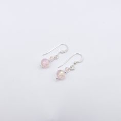 Style: Dangle Material: Sterling Silver Dainty and minimal, yet elegant! Can be worn on any occasion. Thank you for stopping by! Elegant Pink Earrings For Everyday Wear, Pink Elegant Everyday Earrings, Elegant Pink Everyday Earrings, Minimalist Sterling Silver Drop Crystal Earrings, Minimalist Sterling Silver Drop Earrings, Minimalist Sterling Silver Crystal Earrings, Single Feminine Sterling Silver Earring, Feminine Everyday Drop Earrings, Pink Minimalist Teardrop Earrings