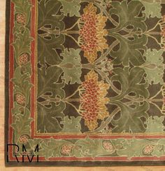 an old rug with leaves and vines on it's border is shown in this image