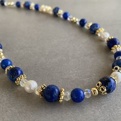 Cheap Blue Beaded Necklaces With Natural Stones, Elegant Royal Blue Round Bead Necklaces, Elegant Beaded Lapis Lazuli Necklace, Elegant Royal Blue Round Beads Necklace, Elegant Royal Blue Round Beaded Necklace, Elegant Handmade Lapis Lazuli Crystal Necklaces, Elegant Handmade Lapis Lazuli Crystal Necklace, Blue Pearl Necklace With Natural Stones As A Gift, Blue Pearl Necklace With Natural Stones For Gift