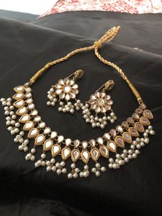 High quality kundan necklace and earrings dipped in 22 karat gold Made to order and shipping time 4 to 6 weeks. Gold Jewelry With Stone Work For Celebration, Gold Bridal Necklace With Gota Work For Diwali, Diwali Gold Jewelry With Stone Work, Gold Bridal Necklace With Gota Work For Celebration, Gold Chandbali Jhumkas For Designer Wear, Gold Chandbalis With Stone Work For Designer Wear, Designer Gold Chandbalis With Stone Work, Kundan Necklaces With Gota Work For Celebration, Gold Kundan Chandbali Necklace With Stone Work