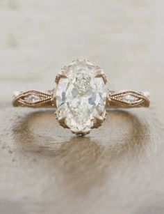 an oval shaped diamond ring with twisted band