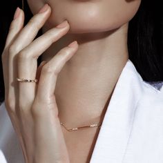 The 2018 Diamond Foundry Deco Capsule draws inspiration from the decadence of the roaring 20’s, made anew by fashioning the deco silhouettes into minimal designs better fit for the 2020s. The asymmetrical bar necklace set with seven scoop-set brilliant diamonds and a single baguette is the perfect bridal accessory or everyday stacking necklace. Size: 15-16" Adjustable Necklace / 35mm Pendant Stones: Cultivated White Diamonds - .18 TCW Please note, diamonds used are top quality - all will be VS-V Luxury Modern Baguette Cut Necklace, Minimalist Diamond Jewelry For Evening, Minimalist White Gold Jewelry For Evening, Minimalist White Gold Evening Jewelry, Modern Bar Necklace For Everyday Wear, Minimalist Delicate Chain Jewelry For Evening, Elegant Bar Necklace With Adjustable Chain For Everyday, Elegant Everyday Bar Necklace With Adjustable Chain, Elegant Yellow Gold Bar Necklace With Single Cut Diamonds