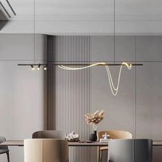 an elegant dining room with grey walls and chairs around the table, along with hanging lights