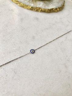 Beautifully light Sterling Silver chain bracelet with Cubic Zirconia Evil Eye charm; adjustable in length up to 7.5 inches This bracelet is perfect for gifting with our matching necklace & stud earrings also available:Necklace:https://www.etsy.com/uk/listing/727886349/sterling-silver-evil-eye-necklace?ga_search_query=Evil%2Beye&ref=shop_items_search_5Earrings:https://www.etsy.com/uk/listing/826524760/sterling-silver-evil-eye-earrings?ga_search_query=Evil%2Beye&ref=shop_items_search_6 Adjustable Delicate Chain Jewelry With Cubic Zirconia, Adjustable Delicate Cubic Zirconia Jewelry, Gift Jewelry With Adjustable Length And Cubic Zirconia, Adjustable Delicate Cubic Zirconia Chain Jewelry, Adjustable Length Sterling Silver Jewelry, Resizable Cubic Zirconia Jewelry For Gifts, Dainty Adjustable Silver Chain Jewelry, Silver Chain Bracelets As Gift, Round Silver Chain Bracelets As Gifts