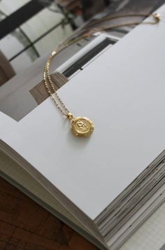 18-karat gold plated floral locket pendant hangs on a sturdy 18-karat gold plated stainless steel chain.  Choose your chain length from the drop-down menu.  SILVER version of this locket is also available. Click the link below to purchase. https://www.etsy.com/ca/listing/1612926901/silver-floral-locket-necklace-with?click_key=f4711079eaf4f5d7fb7c6694b5edeb992b0bbd97%3A1612926901&click_sum=5968e3ba&ref=shop_home_active_1&pro=1&frs=1 This locket is perfect for using as a keepsake necklace and is a thoughtful gift for someone special in your life. You can choose the locket as is, without photos, or have it personalized with your photo (s) and engrave either your initial, name, your birth flower, a special date or a message at the BACK or the locket. You choose your options at checkout. The pi Gold 14k Locket Necklace As A Gift, Gold Pendant Locket Necklace As A Gift, Gold Pendant Locket Necklace For Gift, Elegant Gold Locket Necklace With Charms, Gold Plated Medallion Charm Necklace For Anniversary, Gold Plated Amulet Medallion Necklace As Gift, Gift Round Pendant Locket Necklace, Dainty Gold Plated Pendant Locket Necklace, Round Pendant Locket Necklace As Gift