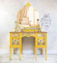 a yellow desk with a mirror on top of it