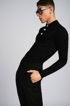 Overview:Made from 100% extra-fine merino wool. This black long-sleeve polo shirt features 3 shell pearl buttons Highlights:- Black Merino Wool- Concealed placket- Ribbed collar, cuffs, and waistband- 3 shell buttons- Gender-neutral Size & fitting:- Model measures: Height 1.86cm; Chest/Bust 93cm; Waist 77cm; Hip 93cm- Model wears a size M Info & Care:- Merinos Extrafine Wool 100%- Hand wash About the brand: At Mercader, we anticipate a movement in fashion on the impact of Seasonless, Genderless, Gender Free, Conscious Fashion, Long Sleeve Polo Shirt, Pearl Buttons, Long Sleeve Polo, Stay Cozy, Ethical Fashion, Polo Shirts, Classic Shirt