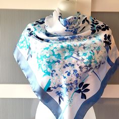 Beautiful and elegant blue silk satin scarf with a gorgeous floral design of cherry and lilac blossom. The scarf combines various shades of blue -  baby blue, powder blue and navy blue on a white background. The scarf has a beautiful sheen. The scarf is large square and can be used as a neck wrap, head cover. hair tie, headband, bag decor, etc. The scarf is marked Kevser Collection. It is in excellent/mint condition and will make a beautiful gift for any occasion! The scarf comes in a gift wrap and with a 'Thank you' card. For more scarves in my store visit: https://www.etsy.com/ca/shop/NostalgicByLiliya?ref=seller-platform-mcnav&section_id=25031148 For other items visit: https://nostalgicbyliliya.etsy.com Cover Hair, Lilac Blossom, Wrap Headband, Spring Dresses Women, Satin Scarf, Spring Accessories, Tie Headband, Lilac Flowers, Flowers Design