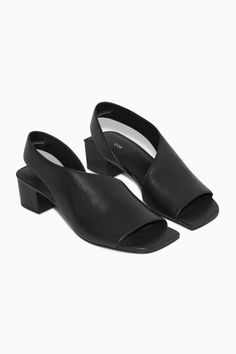 These slingback sandals have a sculptural silhouette that's enhanced by the square toes and wide strap that looks as though it wraps elegantly under the foot. Crafted from supple chrome-free leather, they're designed with padded footbeds and angular block heels. They'll complement just about everything you pair them with.- Slingback straps- Stacked heelsUpper, Lining & Sole: 100% Leather Sleek Summer Slingback Pumps With Padded Heel, Modern Summer Slingback Sandals With Wrapped Heel, Modern Slingback Sandals With Wrapped Heel For Summer, Sleek Pointed Toe Slingback Sandals For Summer, Sleek Open Toe Slingback Pumps With Padded Heel, Sleek Open Toe Slingback Pumps With Sculpted Heel, Sleek Open Toe Slingback Sandals With Sculpted Heel, Modern Slingback Sandals With Branded Heel Counter, Sleek Summer Slingback Pumps With Heel Strap