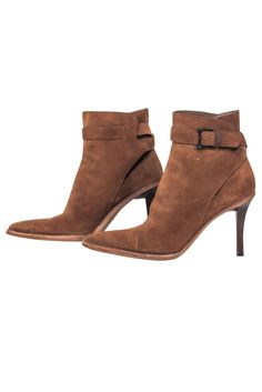 Step out in downtown style with Gucci's suede booties! Crafted with luxurious suede and a leather lining for a cushy fit, these booties add a subtly sophisticated edge to any ensemble. Elevate your look with a pair of these booties, perfect for pairing with a suede jacket for a truly killer look! Size 6 (IT 36) Made in Italy 100% Suede Rubber sole Skinny heel Outer ankle buckle closure Minor blemishes on suede and heel Heel height 4" Shaft 5" Suede Heeled Boots With Heel Pull Tab, Suede Ankle-high Booties, Fitted Suede Booties For Fall, Chic Suede Boots With Heel Pull Tab, Fall Suede Pointed Toe Boots, Winter Suede Booties With Reinforced Heel, Fall Suede Boots With Pointed Toe, Formal Suede Booties With Pointed Toe, Ankle-high Suede Heels For Fall