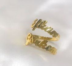 This 14K solid gold double name ring  is a  meaningful gift for your loved one or a special treat just for yourself . You can buy this personalized two name ring as an engagement ring which includes couple's names . This affordable and thoughtful custom multiple name ring gift will surely be treasured by your loved one.   *FEATURES Material : 14 K Solid Gold  Colour : gold * PACKAGING Jewels will be sent nicely wrapped and packed in a box! If specific goods are intended as gifts, please leave us a note. We'll use a special box separately and include a gift card for you! The most unique jewelry you can find, a perfect gift for you and your loved one ... Birthday Gift , Wedding Gift , Gift For Love ,  Bridesmaid Gift , Anniversary Gift , Mother's Day Gift , Graduation Gift * SHIPPING DETAILS Double Name, Gold Packaging, Name Ring, Letter Ring, Name Rings, English Letter, Gold Colour, Ring Women, Ring Gold