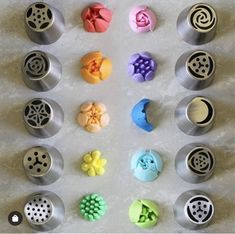 nine cupcake molds in different shapes and sizes on a white counter top,