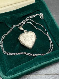 Vintage  silver locket for women. Double sided silver locket with hand engraved back and front.  Silver heart locket. Silver pendant . Silver necklace for women.       Vintage circa 70s. Condition: necklace in perfect vintage condition. Materials: Silver. Rhodium plated silver chain.  Measure: chain 16"/ 41 cm,   Locket  0.7" x 0.7"/  1.8 x 1.8 cm. Package: gift wrap available, please specify when ordering. Delivery: your order will be send by Royal Mail with tracking and signed in 1-2 working d Silver Heart Locket, Silver Necklace For Women, Silver Locket, Gift For Her Birthday, Photo Locket, Silver Lockets, Heart Locket, Pendant Silver, Women Vintage