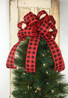 a christmas tree with a red and black bow