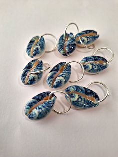 Set of 8 loc rings made with hand painted cowrie shells on stainless steel rings.  Rings open to fit all locs and braids. Unique Hand-painted Jewelry For Beach, Unique Hand Painted Jewelry For Beach, Loc Rings, Afro Jewelry, Braid Rings, Dreadlock Jewelry, Dope Jewelry Accessories, Hair Decor, Hair Charms