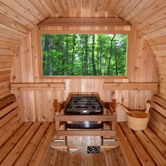 the inside of a wooden sauna with two stoves