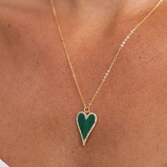 Add a touch of cuteness to your outfit with Lucy CZ Heart Necklace. The green heart pendant and pave outline will bring a playful charm to your everyday look. Share love and joy with this adorable accessory. 18k Gold Plated over Stainless Steel CZ Stones Water & Tarnish Resistant Hypoallergenic Heart Green Necklace, Luxury Green Necklace With Heart Charm, Green Heart, Cz Stone, Heart Necklace, Everyday Look, Heart Pendant, 18k Gold, Gold Plate