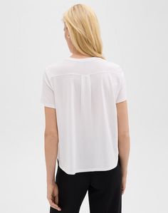 Elevate your wardrobe with our Easy Relaxed Tee Black. Made from ultra-soft organic Pima cotton jersey knit and dyed in Peru, this on-trend short-sleeve tee offers a luxurious and oversized fit. Complete with a patch pocket and back box pleat, this top exudes effortless elegance. Details Short Sleeve Oversized Tee Patch Pocket Style # O0724502 Materials 100% Organic Pima Cotton Care Machine wash on a cold, gentle cycle with similar colors Effortless Spring T-shirt For Casual Gatherings, Effortless Short Sleeve T-shirt For Loungewear, Effortless Summer T-shirt For Casual Gatherings, Summer Viscose T-shirt With Short Sleeves, Effortless Short Sleeve Summer T-shirt, Versatile T-shirt With Shirttail Hem, Versatile Spring T-shirt For Casual Gatherings, Relaxed Fit V-neck T-shirt For Casual Gatherings, Basic Short Sleeve Top With Shirttail Hem For Everyday