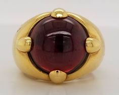 GORGEOUS VINTAGE ITALIAN DESIGN 18K YELLOW GOLD GARNET RING CENTER NATURAL RED GARNET IN ROUND CABOCHON SHAPE WEIGHT 9.57CARAT SIZE 14.5 GORGEOUS RED GARNET CLEAN ,VERY NICE CUT ,LIVELY STONE.NICE LUSTER. RING size 7.5 Ring weighs 12.7 grams Retail value $7,500 net . Appraisal available Formal Red Domed Rings, Gold Ruby Ring With Domed Shape, Gold Dome Ring With Cabochon For Formal Events, Gold Domed Ruby Ring With Gemstone, Formal Gold Dome Ring With Gemstone, Gold Dome Ring With Gemstone For Formal Events, Gold Dome Ring With Gemstone For Formal Occasions, Elegant Red Dome Ring For Formal Occasions, Yellow Gold Dome Ring With Gemstone