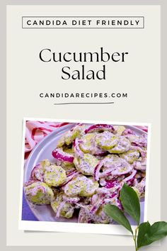 a white plate filled with food next to a leafy green plant and the words cucumber salad on it