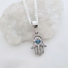 "925 Sterling silver Evil Eye necklace. This Evil Eye necklace is not a tawdry accessory; all you can see in this necklace is made out of Sterling Silver and CZ crystal; CZ comes closer than any other gem material to matching the characteristics of a diamond.  LIKE THIS ITEM?  There's the Facebook and Pinterest , button to Save it to your favorites and revisit it later! ! Or you can  E-mail it! . Take a look at other evil designs: http://etsy.me/XhfBGw  Add your personal touch to this necklace! . Need initials, symbolic charms, etc,? Please visit my adds on section: http://etsy.me/UFmfXa DESCRIPTION: . 925 Sterling Silver Evil Eye 10mmD. . Sterling Silver hearts 7mm with your choice initial or disc 8mm upon request. . Swarovski birthstone of your choice month. ~ 925 Sterling Silver Italian Silver Star Of David Jewelry With Charms, Nickel Free Sterling Silver Amulet Necklace, Symbolic Round Pendant Necklace, Spiritual Sterling Silver Necklace For Gift, Spiritual Sterling Silver Nickel-free Charm Necklace, Spiritual Sterling Silver Nickel Free Charm Necklace, Symbolic Necklaces With Silver Chain And Round Pendant, Symbolic Necklaces With Round Silver Pendant, Symbolic Necklace With Silver Chain And Round Pendant