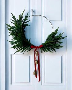 a christmas wreath hanging on the front door