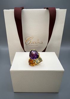 This beautiful handmade ring by Canova Jewelry is a perfect gift for any special occasion, whether it's for an engagement, wedding, anniversary, birthday or Valentine's Day. The ring features three natural gemstones, including a stunning purple amethyst as the main stone, along with citrine and green amethyst/prasiolite. The multicolor ring is made of 925 sterling silver and is designed with a cocktail style that showcases the beauty of nature and the luck and love that comes with it. The Ukraine-made ring is a unique piece of fine jewelry that is perfect for anyone who loves bohemian and magical themes. This piece is a true beauty that will surely captivate anyone's heart. Luxury Multi-stone Amethyst Wedding Ring, Elegant Diamond Ring As Gift, Luxury Citrine Gemstones For Gifts, Luxury Citrine Gemstones With Accents, Luxury Amethyst Ring With Gemstone Accents As Gift, Elegant Multi-stone Amethyst Ring Gift, Exquisite Topaz Ring With Gemstone Accents As Gift, Luxury Rings With Stones, Luxury Yellow Gold Rings With Stones