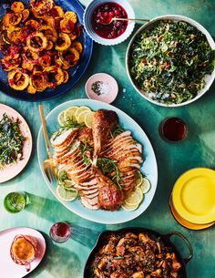 a table topped with plates and bowls filled with different types of food next to each other