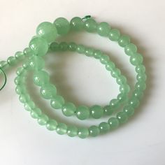 "6mm To 13mm Green Chrysoprase Color Jade Round Beads Green Jade Smooth Round Beads 18 Inch Strand Jade Necklace, Jade Jewelry GDS1793. Gemstone: Jade Size(mm): 6-13mm Length(inch): 18\", 65pcs Aprox Weight: 190gms Approx Color: Green (Color Treated) Item Code: GDS1793 (Weight, Measurements and number of pieces are approximate) You can get Authenticity Certificate at an extra cost of $15.00 We guarantee that the raw diamonds we offer are conflict-free--we only source socially responsible diamond Jade Gemstone Beads, Jade Beaded Necklaces With Round Beads, Green Beaded Necklaces With 8mm Round Beads, Round Green Beaded Necklaces With 8mm Beads, Jade Gemstone Beads For Jewelry Making, Jade Gemstone Beaded Necklaces, Jade Necklace With Spacer And Round Beads, Jade Beaded Necklaces With 8mm Beads, Jade Necklace With Spacer Beads