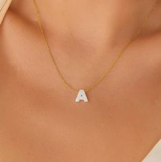 "Opal Letter Necklace, White Opal Letter Necklace, Letter Necklace, Opal Necklace, Danity Letter Opal Necklace, Letter Opal Necklace Material: 925K Sterling Silver /  14K Solid Gold Color: Gold / Silver / Rose Gold Chain Length: 14\"/ 15\"/16\"/17\"/ 18\"/ 19\"/20\"/ 22\" Opal's name came from Opalus of Ancient Greece. Opal has variable color options because of translucent minerals, and the opal symbolizes love, luck, truth, and hope. The Ancient Greeks believed it protected them from disease, and it was like an amulet. Nowadays, opal is one of the most used gemstones. Here is our dainty  Opal Necklace with a unique chain, and we produce it with a white opal pendant with a teardrop cut. There are 925K Sterling Silver and  14K gold variations. It is also a drop necklace for weddings, engage White Initial Pendant Necklace With Clavicle Chain, White Initial Pendant Clavicle Necklace, White Clavicle Chain Necklace With Initial Pendant, Sterling Silver White Initial Pendant Necklace, White Sterling Silver Initial Pendant Necklace, White Initial Pendant Necklace With Delicate Chain, White Sterling Silver Charm Necklace With Initial Pendant, Dainty White Sterling Silver Initial Necklace, White Pendant Necklaces For Mother's Day