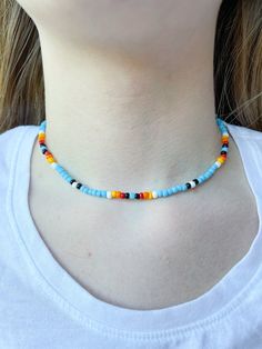 This beautiful and colorful necklace has already become a staple accessory in my jewelry collection! I love the gradient of colors, it really reminds me of a beautiful morning sunrise. This necklace is 16 inches long and made with durable stretchy string! Handmade Light Blue Necklaces For Summer, Handmade Light Blue Necklace For Summer, Blue Beaded Necklaces For Jewelry Making In Summer, Handmade Light Blue Necklaces, Blue Round Beads Necklaces For Summer, Handmade Blue Necklace For Summer, Bohemian Light Blue Necklaces For Summer, Casual Light Blue Jewelry With Colorful Beads, Handmade Light Blue Beaded Necklace For Summer