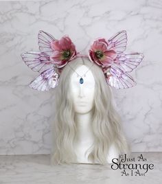 A real must-have statement crown for all fairies!  A beautiful pink magnolia flower fairy headdress. The wings are lightweight and far more durable than their glassy appearance might suggest! They are backed with wire, which is what gives them their gorgeous curve. They are flexible to touch, and may be very slightly adjusted to give a deeper/more shallow curve. The headdress is decorated with pink magnolia flowers and blossoms. Sparkling Swarovski beads hang over the forehead from a silver chai Shop Fairy Wings, Fairy Wings Costume Cheap, Garden Fairy Costume Wings, Head Accessories Wings, Pink Fairycore Dress For Garden Party, Pink Fairy Dress For Garden Party, Pink Fairy Dress For Costume Party, Pink Fairycore Dress For Costume Party, Whimsical Pink Crown Headpiece