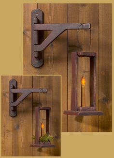 two wall sconces with candles in them hanging on a wooden wall next to each other