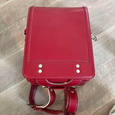 Randoseru : This randoseru made by Tsuchiya Bag company Which is one of the best randoseru maker in Japan. Its made by high quality Cowhide.  Item: Cowhide Leather school Bag / Japanese Randoseru - Red & White No.rnd009 Condition: Used/ Good. Please check the listing pictures. Size: Adult Wearable You could put your laptop without any ploblem. Tsuchiya Bag Company / Made in Japan Tsuchiya bag is one of the best randoseru maker in Japan. https://fujiyamarock.etsy.com Shipping Japan Post takes abo Rectangular Laptop Bag For Students, Rectangular School Satchel With Luggage Sleeve, Rectangular Laptop Bag For Back To School, School Satchel Shoulder Bag With Luggage Sleeve, School Satchel Travel Bag With Adjustable Strap, Rectangular Student Backpack, Rectangular Leather Satchel For Students, Leather Satchel Backpack For Students, Red Rectangular Travel Backpack