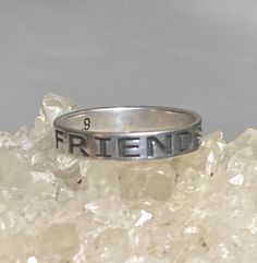 Friends Forever ring Friendship band sterling silver women girlsSize  8.75 Between a size 8.75 and a size 9Weight  8g  Widest part of band       5/8"Thinnest part of band    3/8"Free Shipping & Free Postal Insurance Delivered in a Gift Box If you do not want the ring polished and want to leave the natural patina please let me know at the time of purchase as I do polish rings before I ship rings out. ThanksFree First Class shipping and postal insurance is included. If you want to upgrade to p Promise Stackable Rings Stamped 925, Silver Stackable Promise Rings Stamped 925, Silver Stackable Rings For Promise, Stamped 925, Sterling Silver Friendship Ring, Personalized Silver Friendship Rings, Personalized Sterling Silver Rings For Friendship, Silver Vintage Jewelry For Friendship, Friendship Sterling Silver Ring, Silver Hypoallergenic Engraved Promise Ring