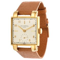 Classic Yellow Gold Watch Bands With Rectangular Dial, Classic Rectangular Watches With Subdials, Classic Gold Watch With Square Face, Yellow Gold Business Watch With Rectangular Shape, Yellow Gold Business Watches With Rectangular Shape, Timeless Rectangular Chronometer Watch, Vintage Rectangular Chronometer Watch, Vintage Rectangular Watch Accessories With Diamond Hour Markers, Antique Rectangular Watch Band For Formal Occasions