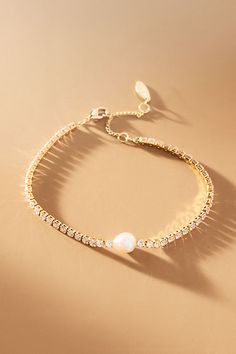 The Single Pearl Bracelet offers timeless elegance with its understated simplicity, adding a touch of sophistication to any ensemble. | Single Pearl Bracelet by Anthropologie in Gold, Women's, Gold/Plated Brass/Freshwater Pearl Dainty Wedding Bracelet, Gold Bridal Bracelet, Mother Of The Bride Bracelet, Gold Bracelet With Pearls, Maid Of Honor Jewelry, Wedding Jewelry Pearl, Gold Elegant Jewelry, Maid Of Honor Gifts From Bride, Vintage Gold Pearl Bracelet