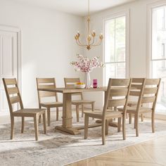 a dining room table with chairs and a chandelier