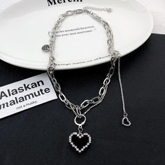 5 business days order processing time. 43cm + 5.6cm adjustable chain. Trendy Multi-strand Charm Necklaces, Trendy Alloy Charm Necklaces, Trendy Alloy Charm Necklaces With Chain, Trendy Metal Charm Necklace With Adjustable Chain, Alloy Heart Pendant Jewelry With Chain, Layered Metal Necklace Gift, Trendy Dangle Chain Necklaces, Trendy Heart Pendant Necklace With Silver Chain, Trendy Dangle Chain Necklace