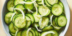 sliced cucumbers and onions in a bowl