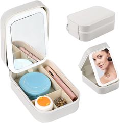 an open white box with various items in it, including a photo and other things inside