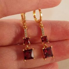 Garnet Earrings Gold, Red And Gold Jewelry Aesthetic, Red Crystal Drop Earrings For Gifts, Red Dangle Crystal Earrings For Anniversary, Red Drop Crystal Earrings For Anniversary, Elegant Red Hoop Earrings With Ear Wire, Red Cubic Zirconia Earrings For Gift, Red Dangle Crystal Earrings As A Gift, Red Dangle Crystal Earrings For Gift