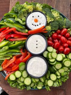 a snowman made out of vegetables and dip