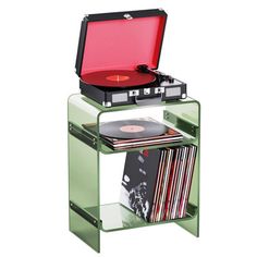 the record player is sitting on top of an acrylic stand with records and cds